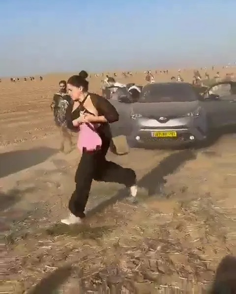 Hundreds were seen fleeing Hamas gunfire at the festival in a desperate bid to escape