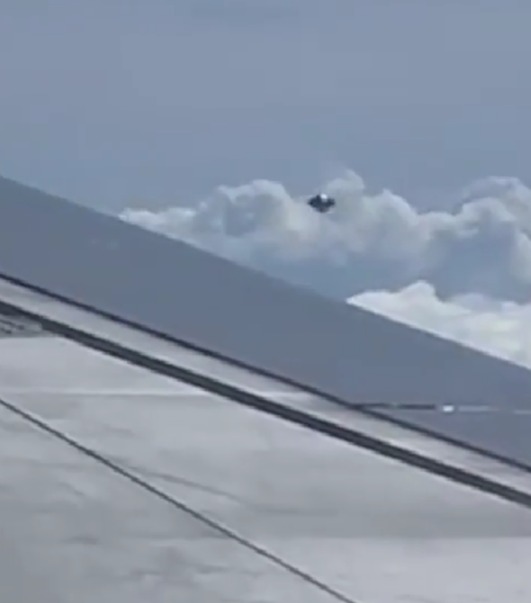 The mystery object was filmed flying next to a plane going over Colombia