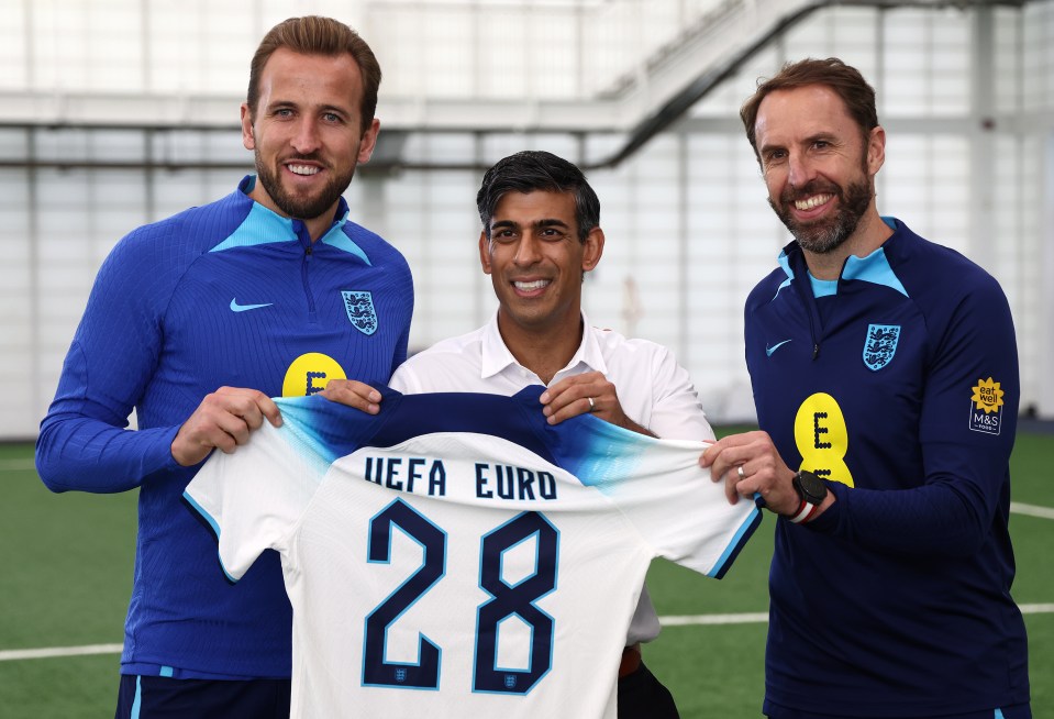 Prime Minister Rishi Sunak poses for a photograph with England striker Harry Kane and England Manager Gareth Southgate during a visit to St George's Park