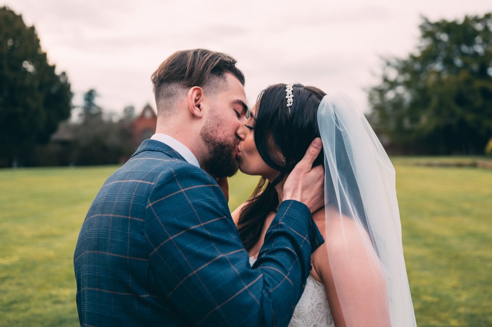 The couple shared a snog during their photos