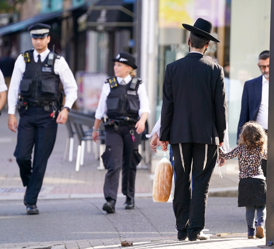 Police patrol the predominantly Jewish area of Golders Green in North London