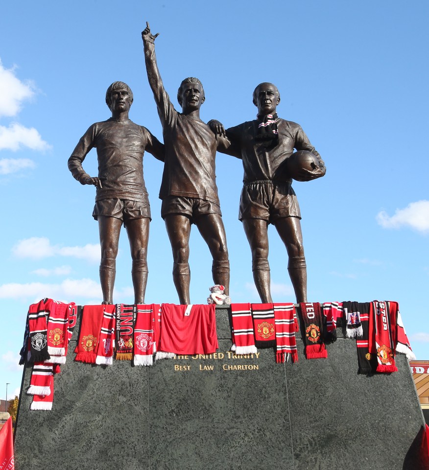 Tributes at the United Trinity statue.