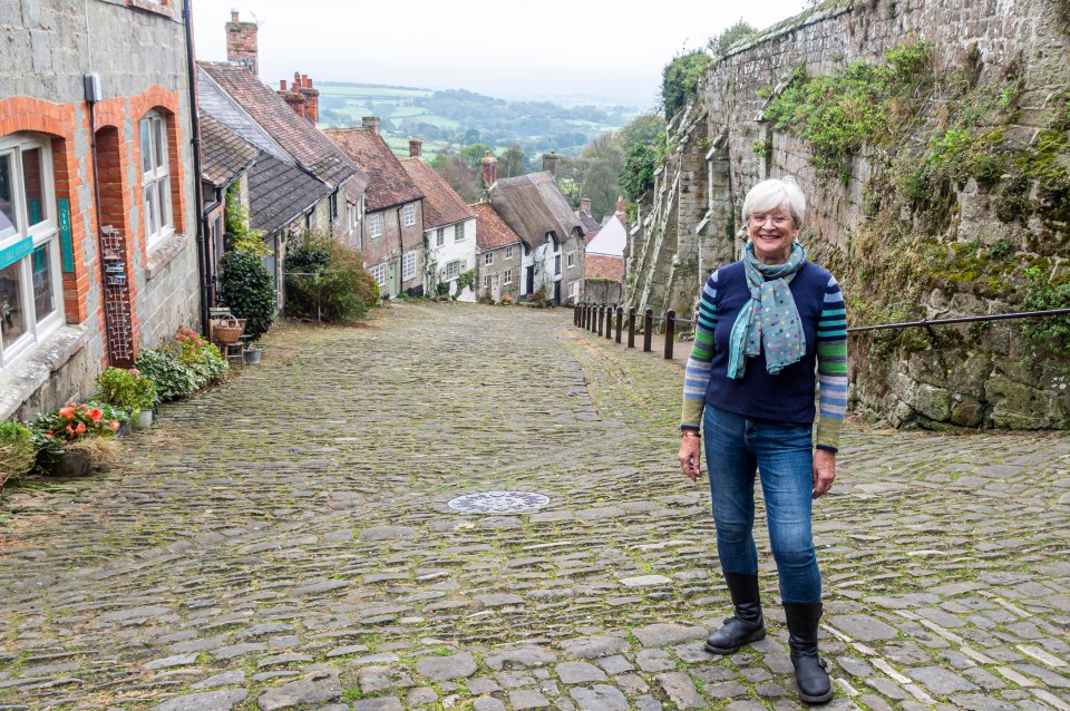 Gold Hill Museum chair of trustees Elaine Barratt poses on the famous hill