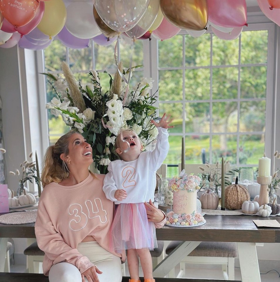 She decorated the house with beautiful flowers and a variety of pumpkins