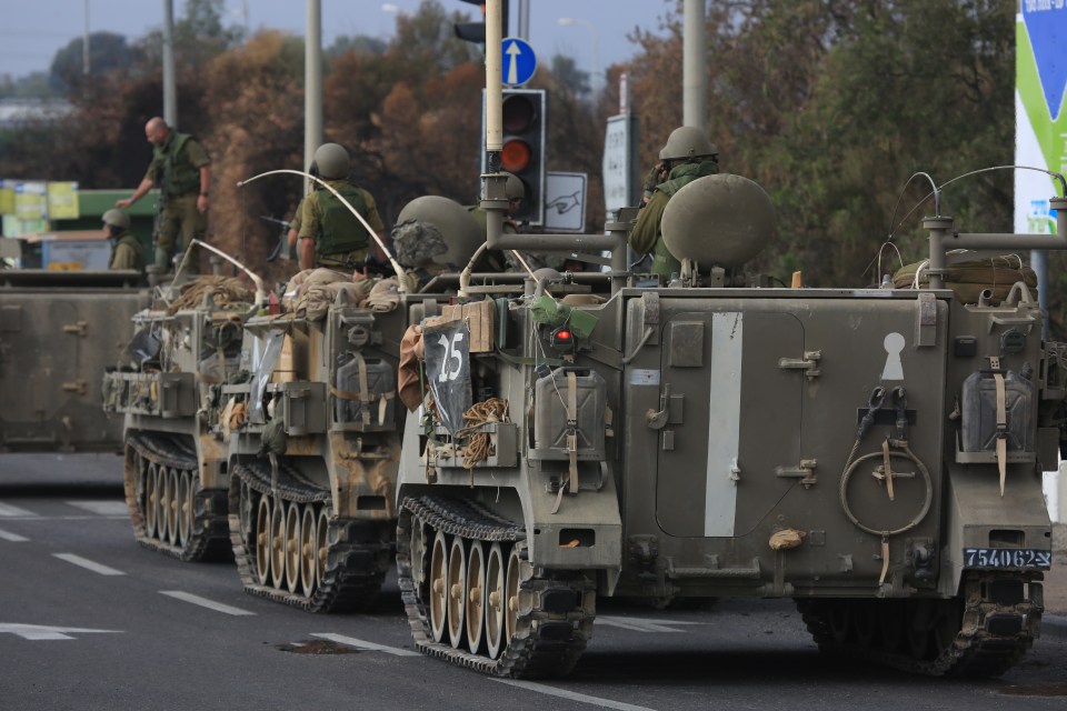 Israeli troops and armoured vehicles heading to Gaza's border