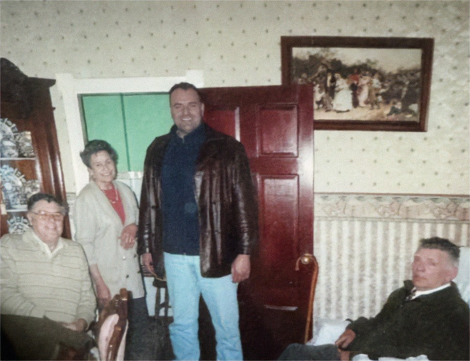 John with his father, mother and uncle