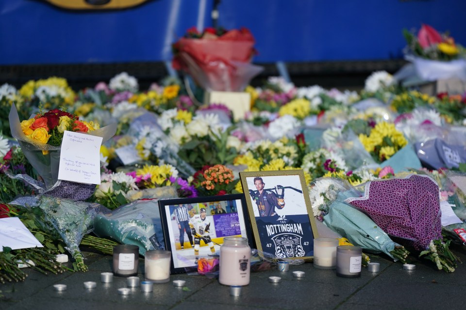 Flowers, written messages and candles have formed a memorial outside the Motorpoint Arena