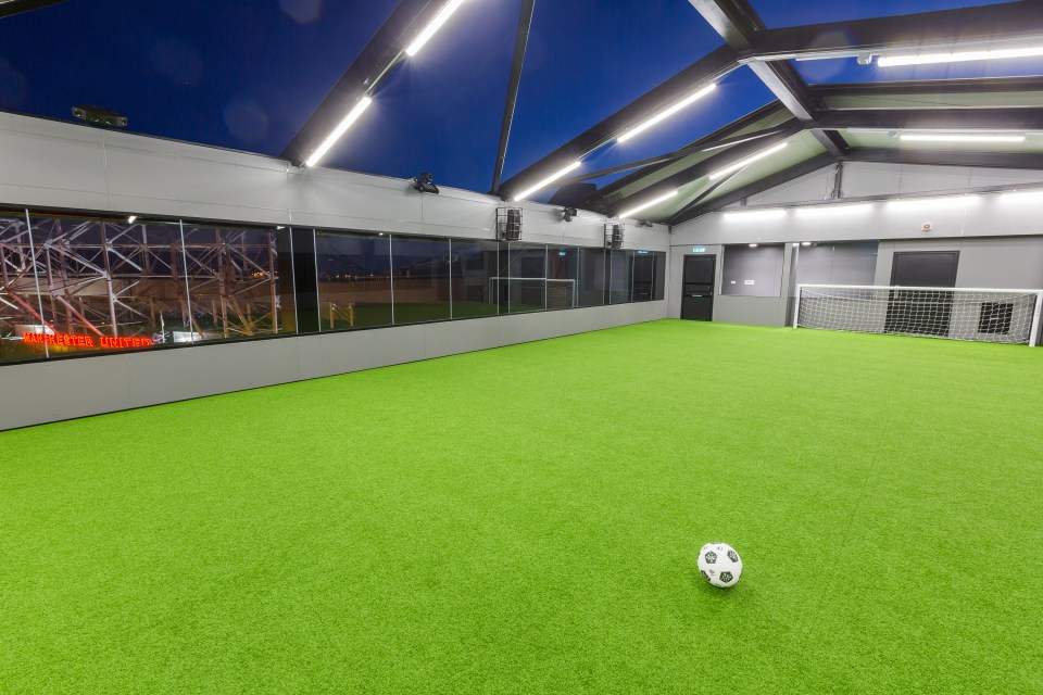 A football pitch with a retractable roof is on top of Hotel Football