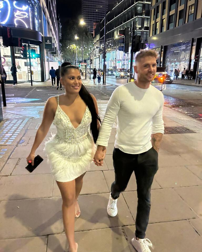 Co-stars Arthur and Tasha held hands as they walked the streets of London