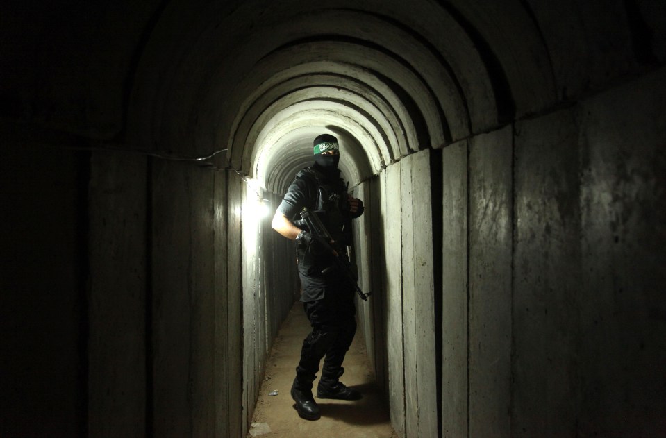 An armed Hamas terrorist pictured inside the tunnels that Israeli troops face a bloodbath battle in