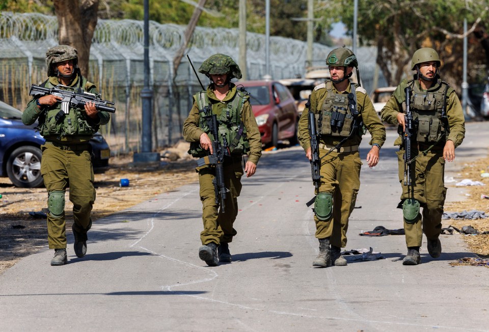 Israeli soldiers in Nir Oz on the Gaza border are still searching for, and finding, Hamas terrorists near the massacre sites - with fears they are lying low and preparing to launch more attacks