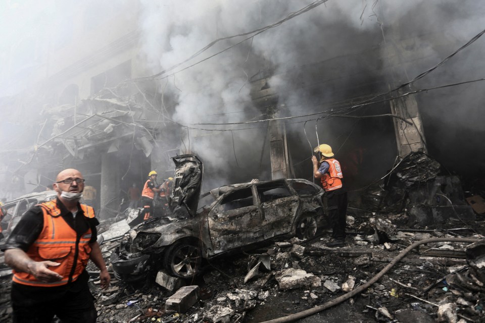 Rescuers race to find survivors after an air strike in Jabalia, northern Gaza