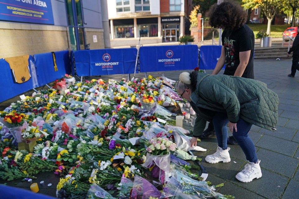 Devastated fans have left flowers outside the Motorpoint Arena in Nottingham