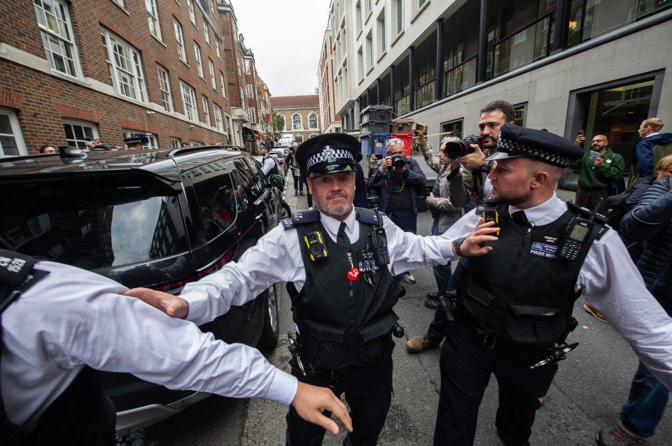 Police had to guard the Labour Leader from protestors screaming profanities at him