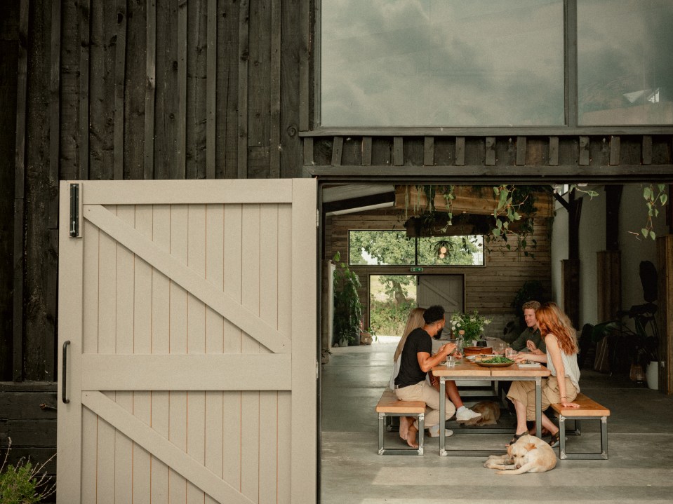 There are communal barns with kitchens, dining areas and cosy rooms including a library and screening room