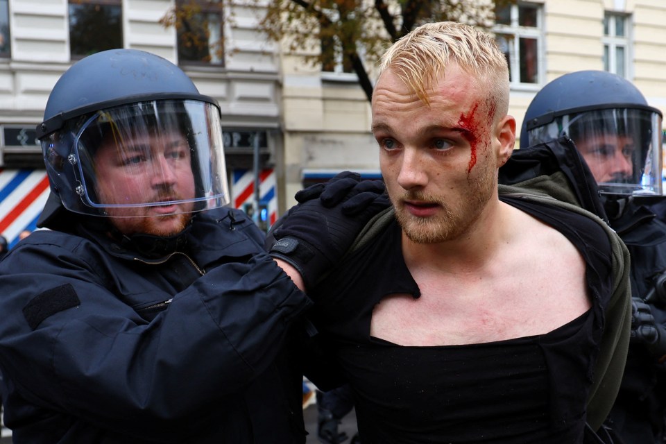 A Pro-Palestinian demonstrator is detained during a protest in Germany