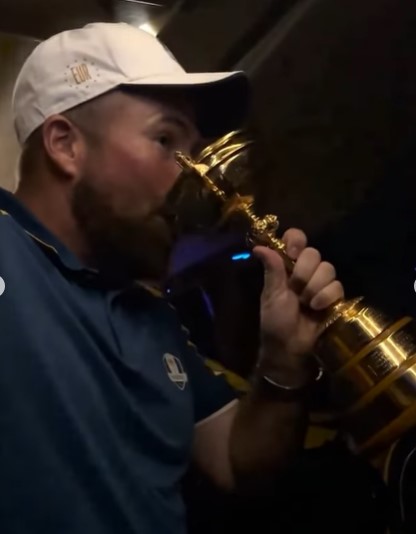 Shane Lowry also chugged a beer from the cup