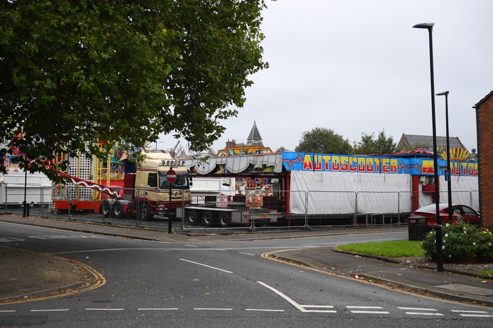 A woman has been seriously hurt after a car ploughed into a fun fair in Wigan