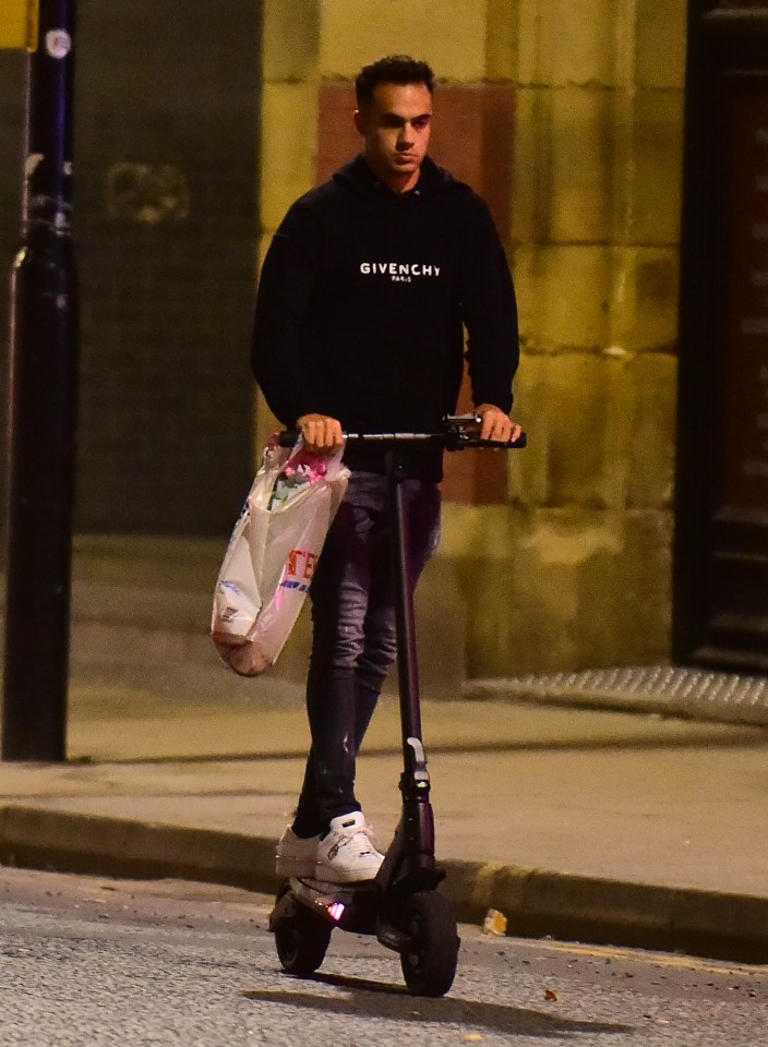 The defender was snapped riding an electric scooter on Tuesday night