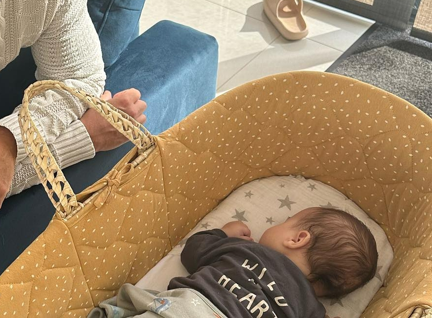 She shared a snap of her baby son Thiago lying face-down in his moses basket