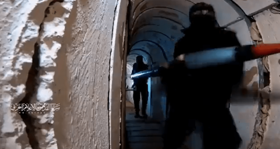 Hamas fighters carrying rockets through one of the underground rat-runs