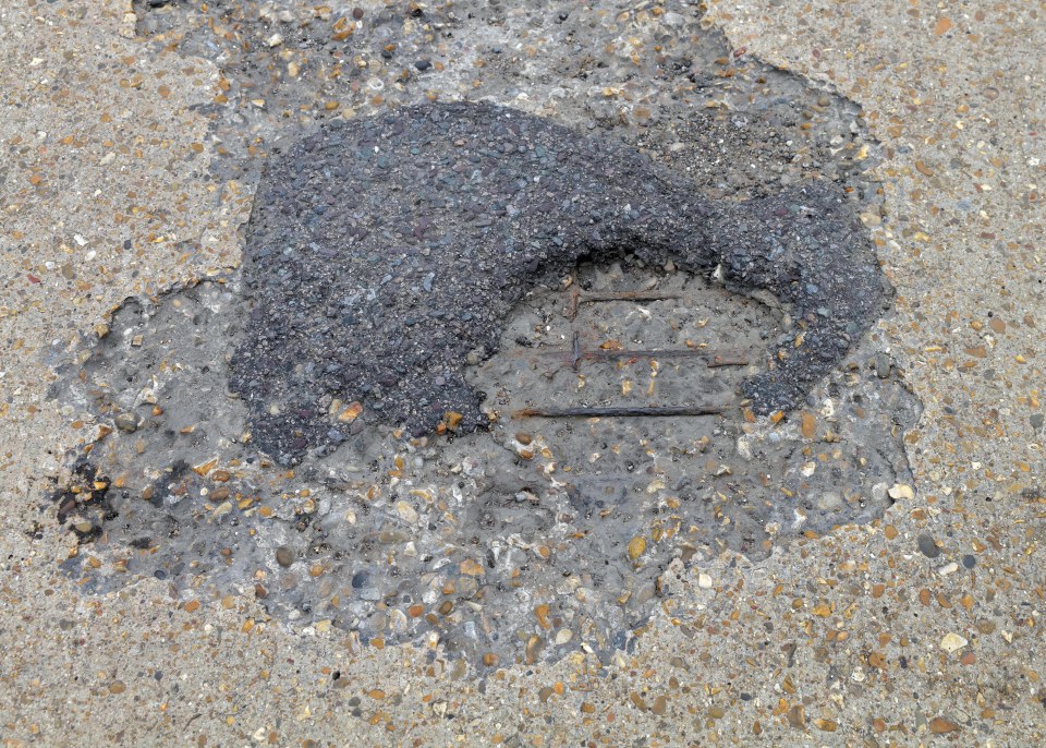 This road surface is on a busy route used by large freight firms and shoppers heading to a local retail park