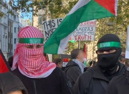 Met Police want to speak to these men who appear to be wearing Hamas-style headbands