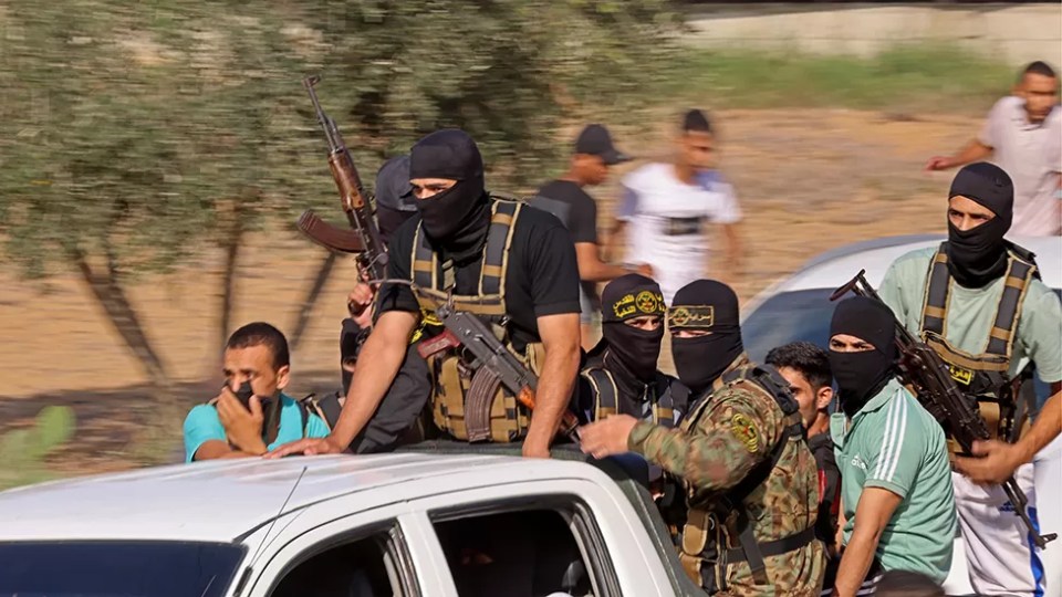 Hamas fighters heading towards the Israeli border during the October 7 attacks