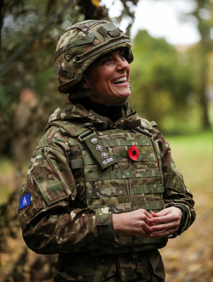 Kate reacts as she visits The Queen's Dragoon Guards Regiment for the first time