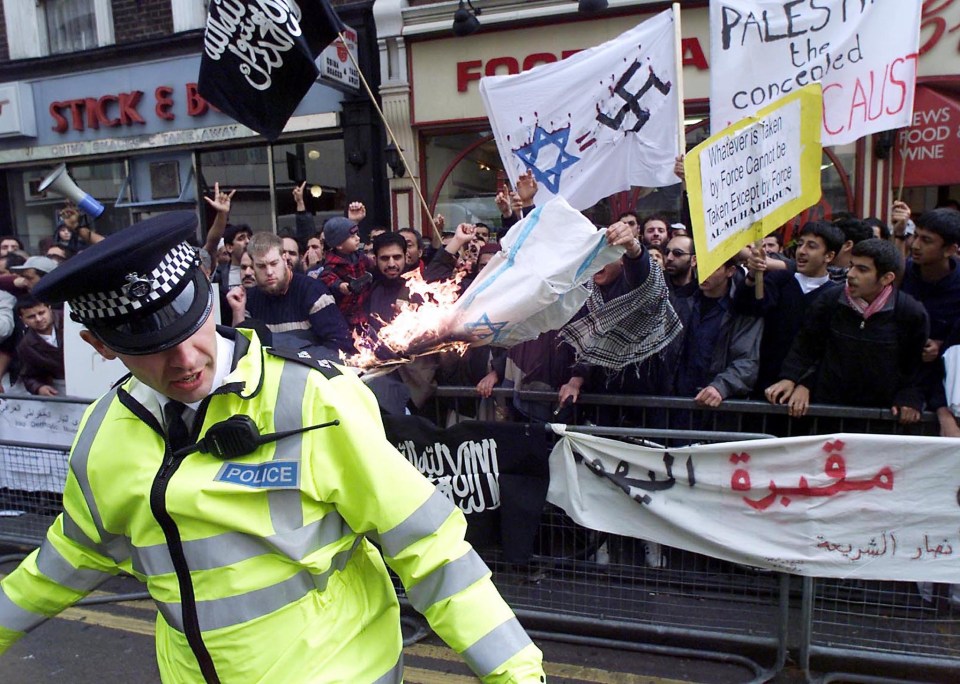 Feeble police stand by and watch protestors call for the eradication of Israel, yet arrest a man for an online complaint about Palestinian flags