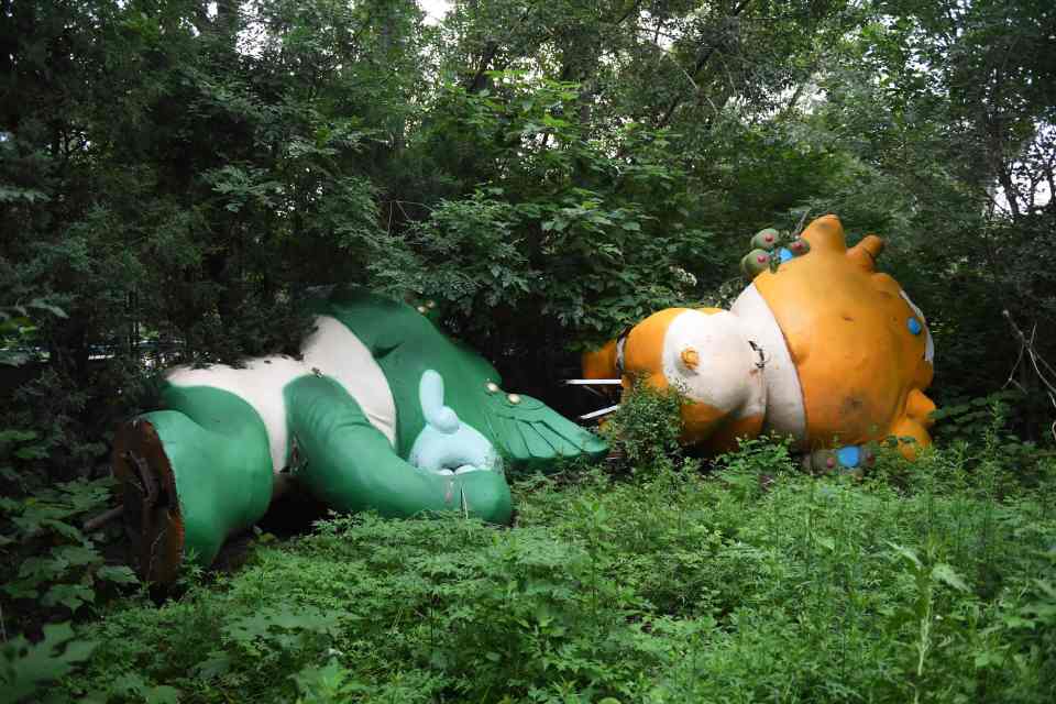 Even the Olympics mascots -  Nini, Yingjing and Beibei - have been left unattended lying on the ground