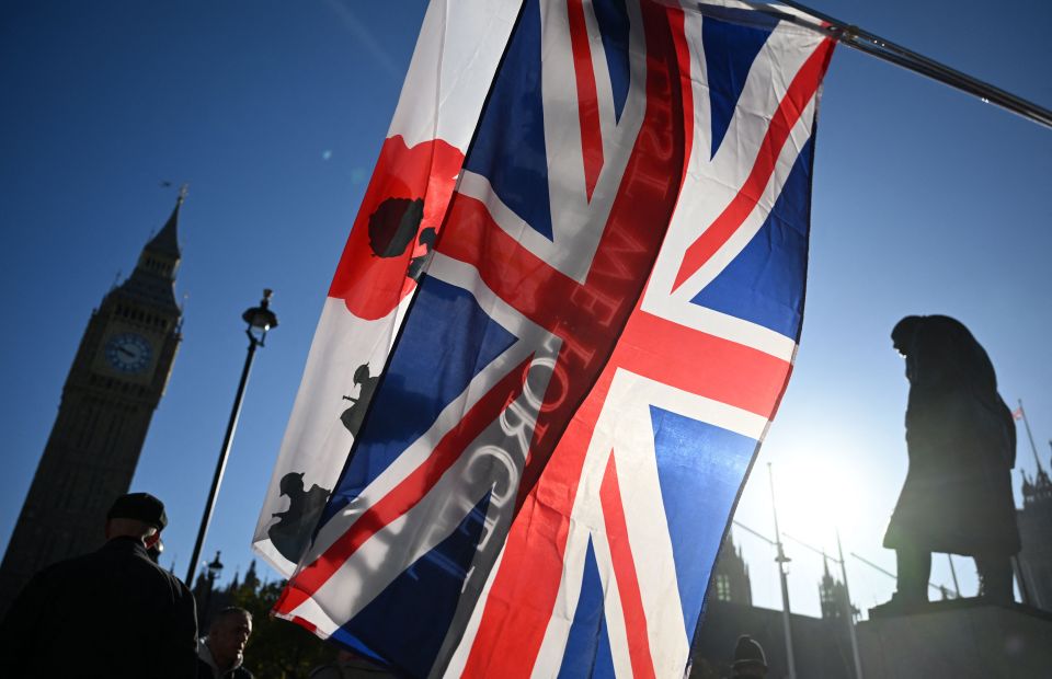 Union Jack flags waved beside the Churchill Statue in Parliament Square