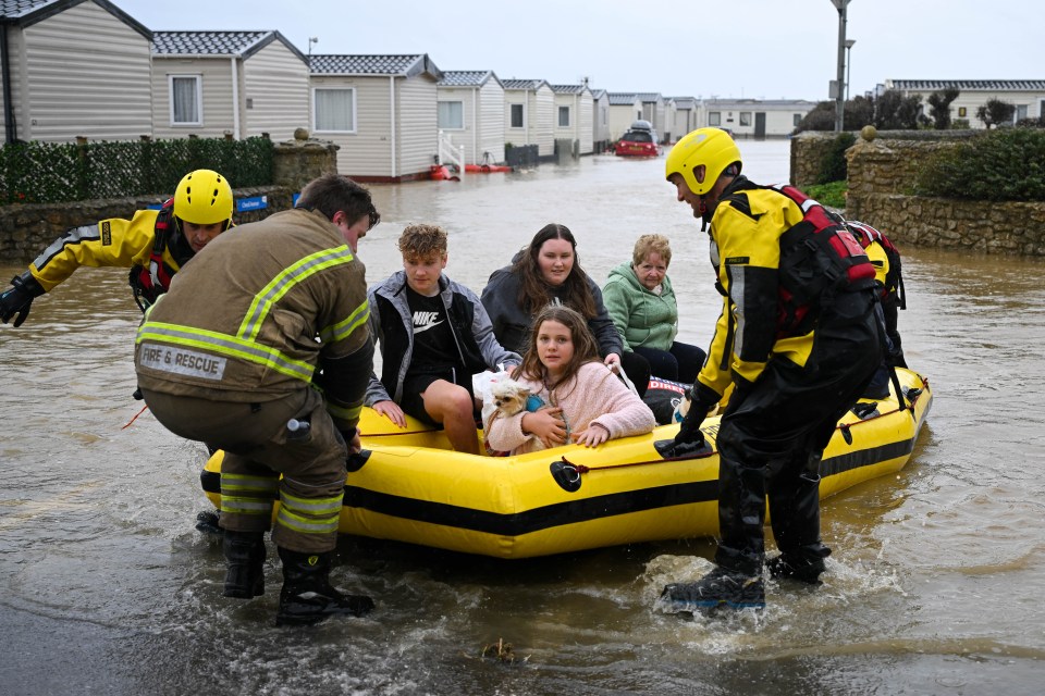 Holidaymakers are rescued from their chalets in Burton Bradstock, Dorset