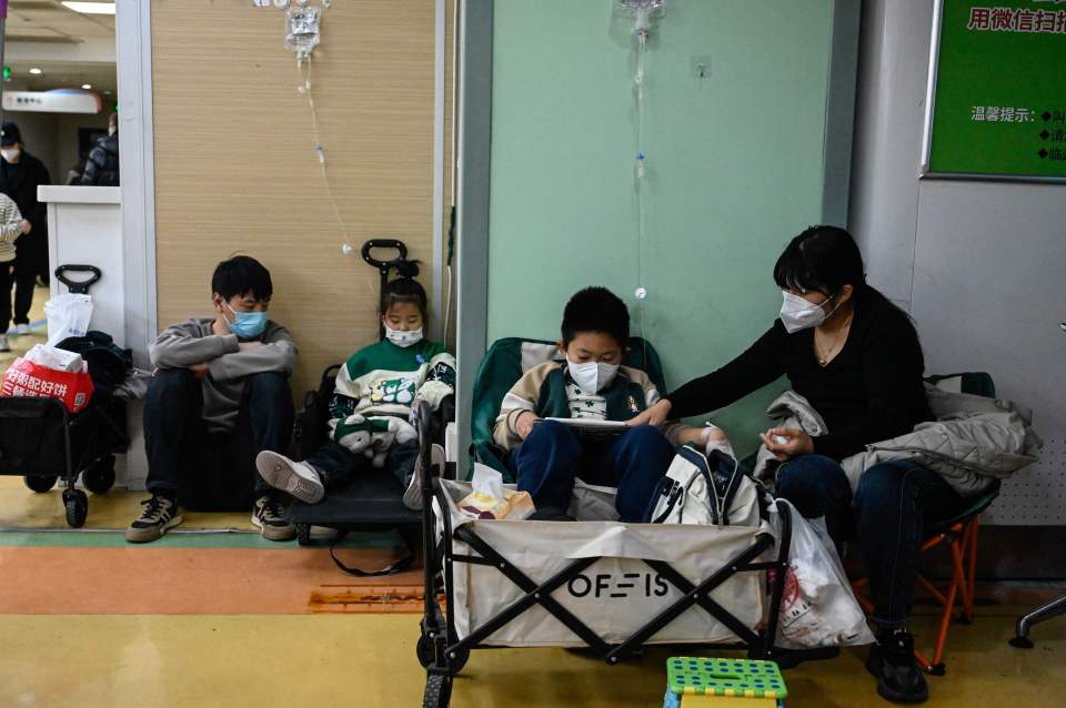 Children hooked up to IVs on a hospital floor in Beijing