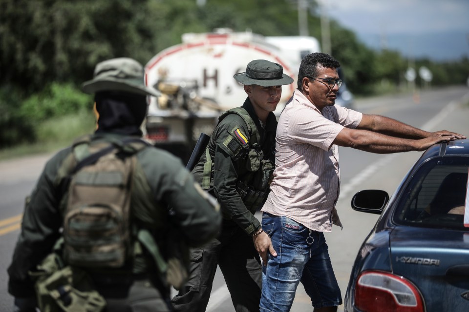 Police inspected vehicles and their occupants as they enter and exit Barrancas, La Guajira