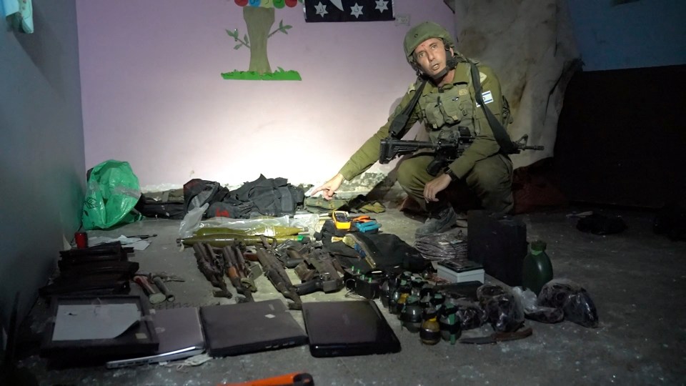 A cache of AK-47 rifles, explosives, grenades, suicide-bomb vests and cash were also found