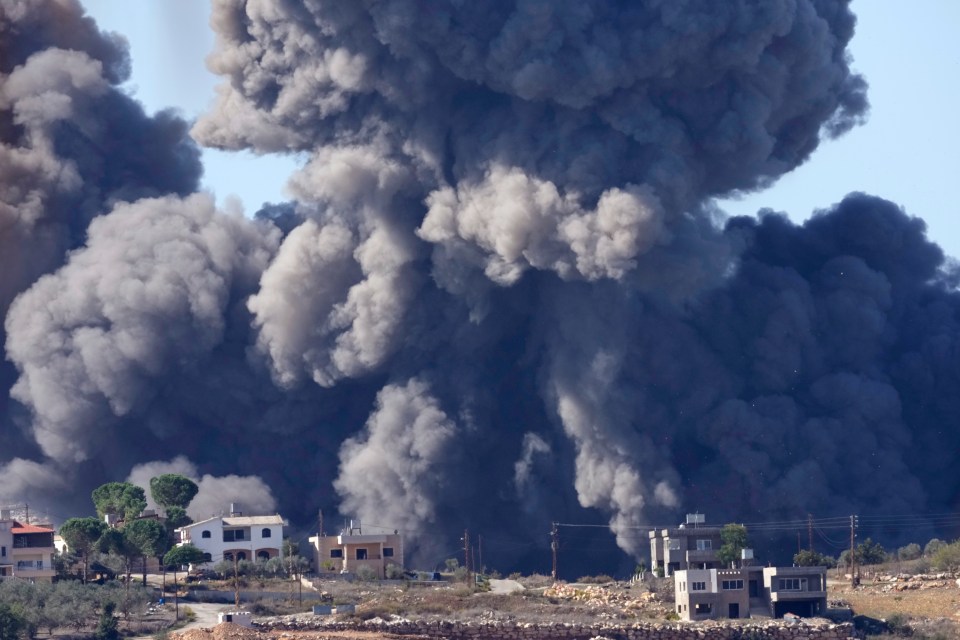 Black smoke rises from an Israeli airstrike on the outskirts of Aita al-Shaab, a Lebanese border village