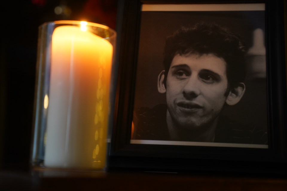 A candle burns next to a photograph of The Pogues frontman Shane MacGowan at the Mansion House, in Dublin