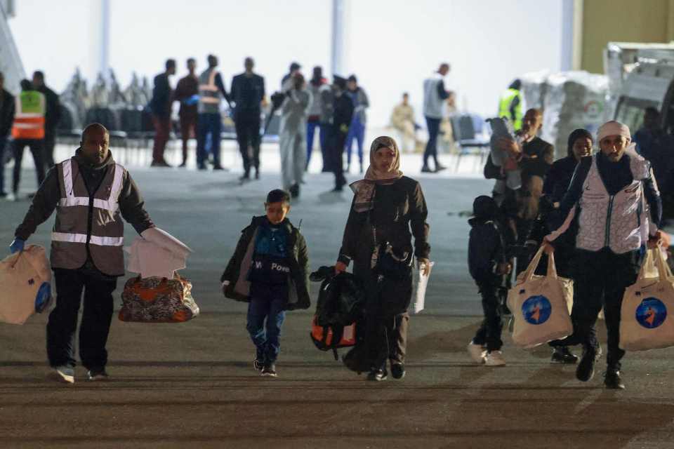 Palestinians evacuated from the Gaza Strip board a plane at Egypt’s El-Arish International Airport bound for Abu Dhabi early on November 27