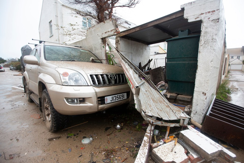 A wall crumbled onto this Land Cruiser in Jersey