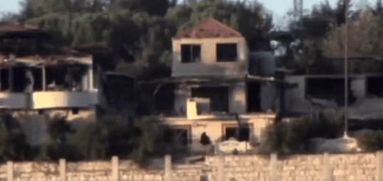 A Lebanese home just seconds before its hit by an Israeli airstrike