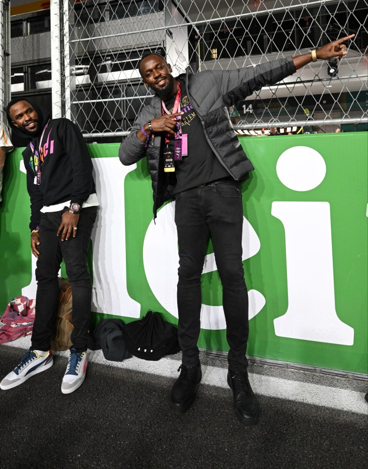 Usain Bolt did his trademark celebration along the pit wall