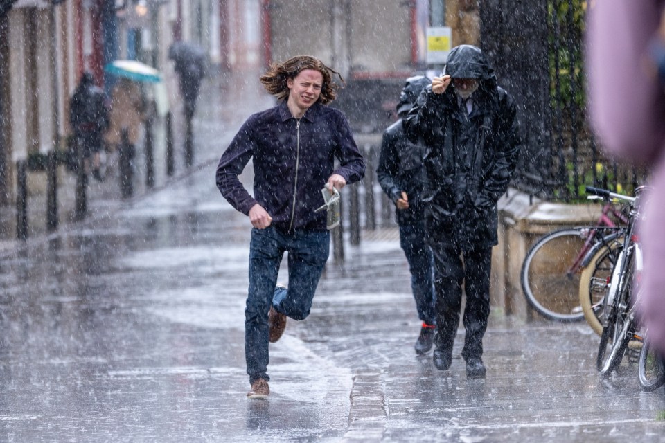 People getting caught out in the rain in Cambridge on Wednesday afternoon