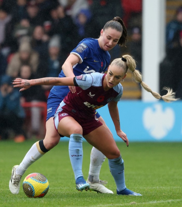 WALSALL, ENGLAND - NOVEMBER 04: Niamph Charles of Chelsea battles for the ball with Alisha Lehmann of Aston Villa during the Barclays Women´s Super League match between Aston Villa and Chelsea at Poundland Bescot Stadium on November 04, 2023 in Walsall, England. (Photo by Morgan Harlow - The FA/The FA via Getty Images)