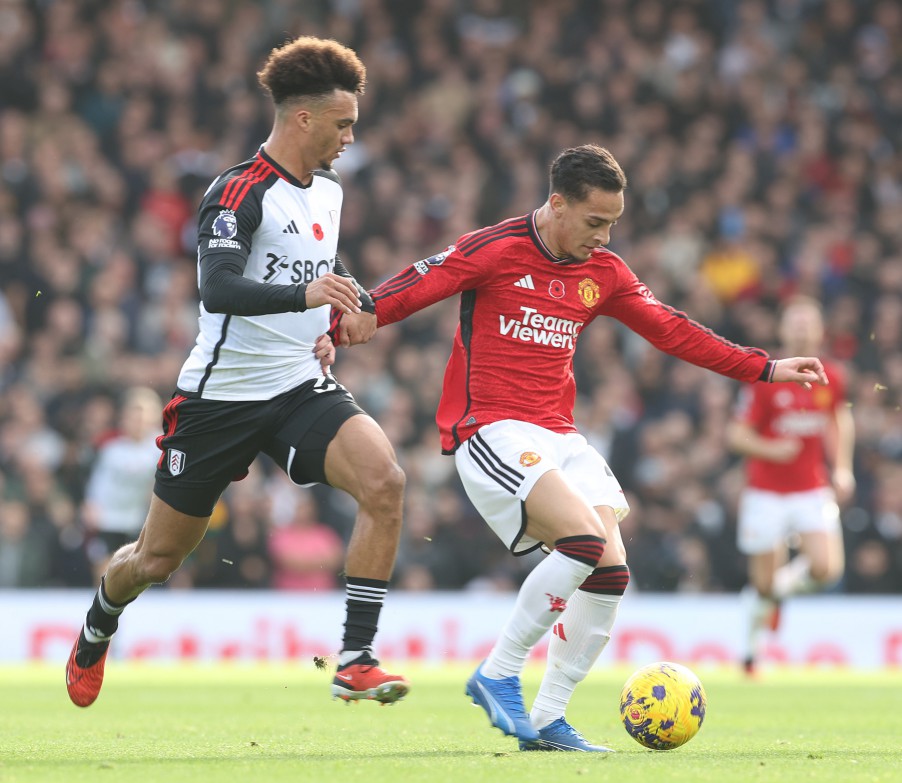 LONDON, ENGLAND - NOVEMBER 04: Antony of Manchester United in action with Antonee Robinson of Fulham during the Premier League match between Fulham FC and Manchester United at Craven Cottage on November 04, 2023 in London, England. (Photo by Matthew Peters/Manchester United via Getty Images)