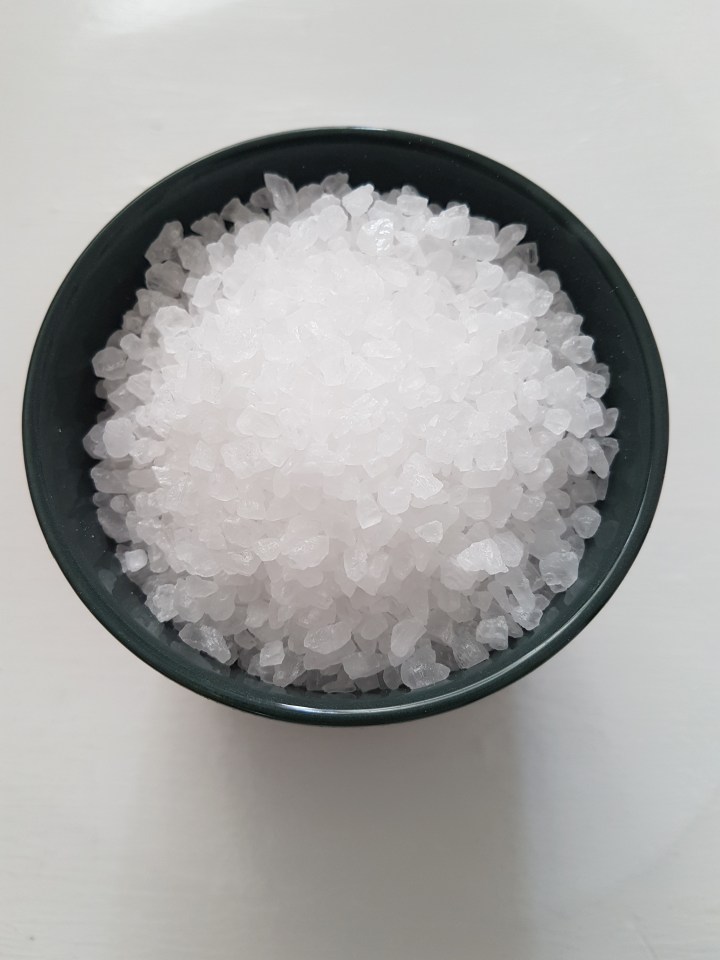 Like silica gel, coarse salt is also absorbant and can be bought cheaply at a supermarket