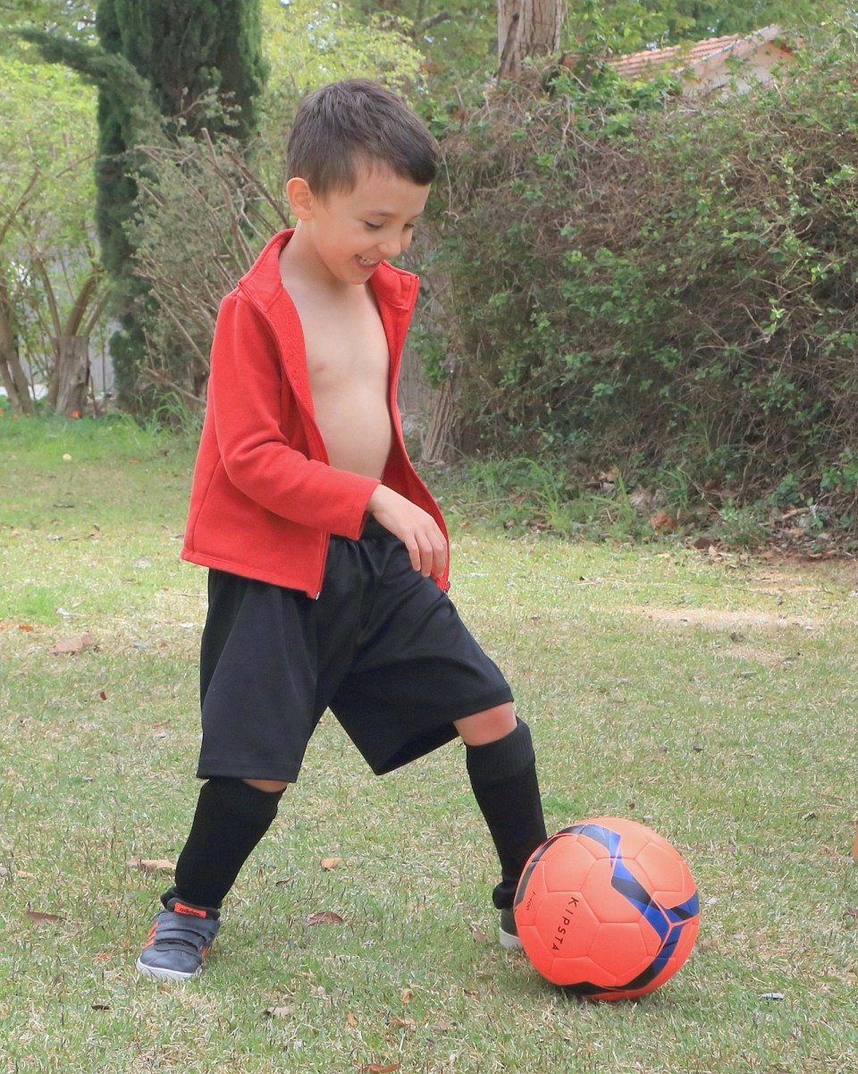 Naveh Shoham, eight, spent 50 days in the hell of Gaza - but has bounced back with a kickabout