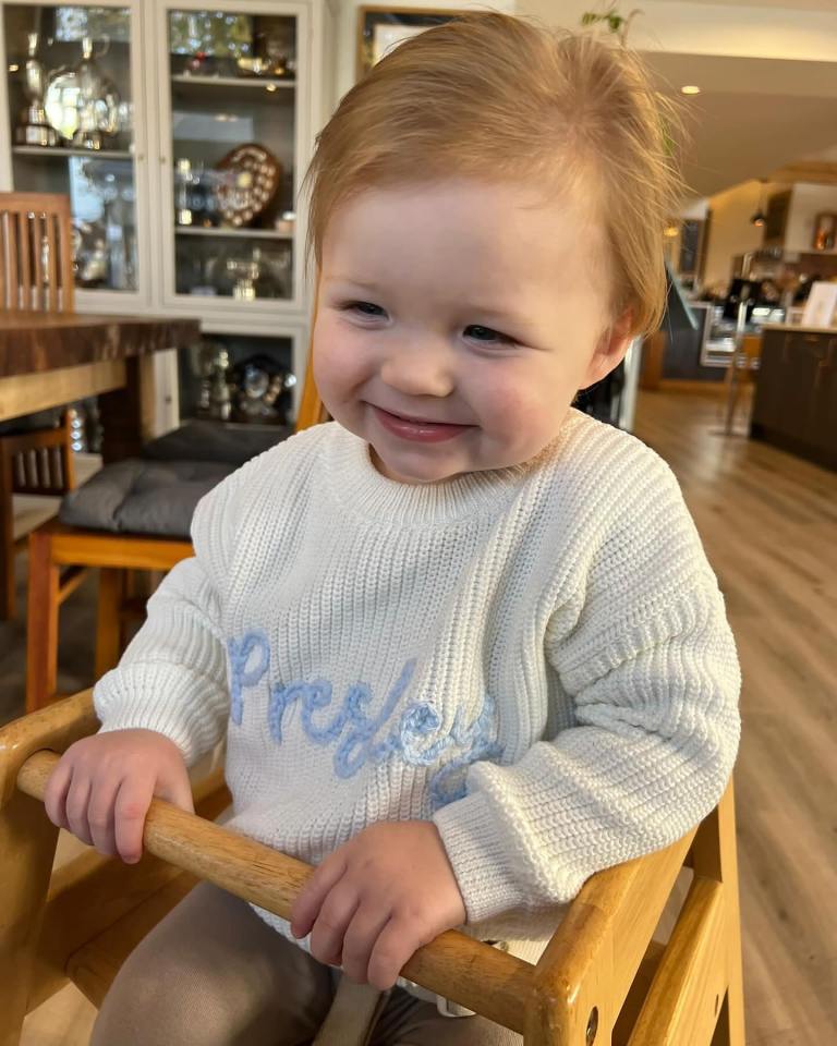 Her tot Presley, one, was all smiles in his high chair