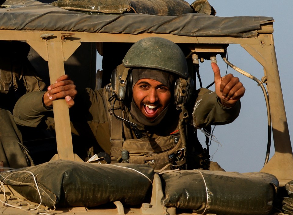 An Israeli soldier leaving Gaza during the temporary truce