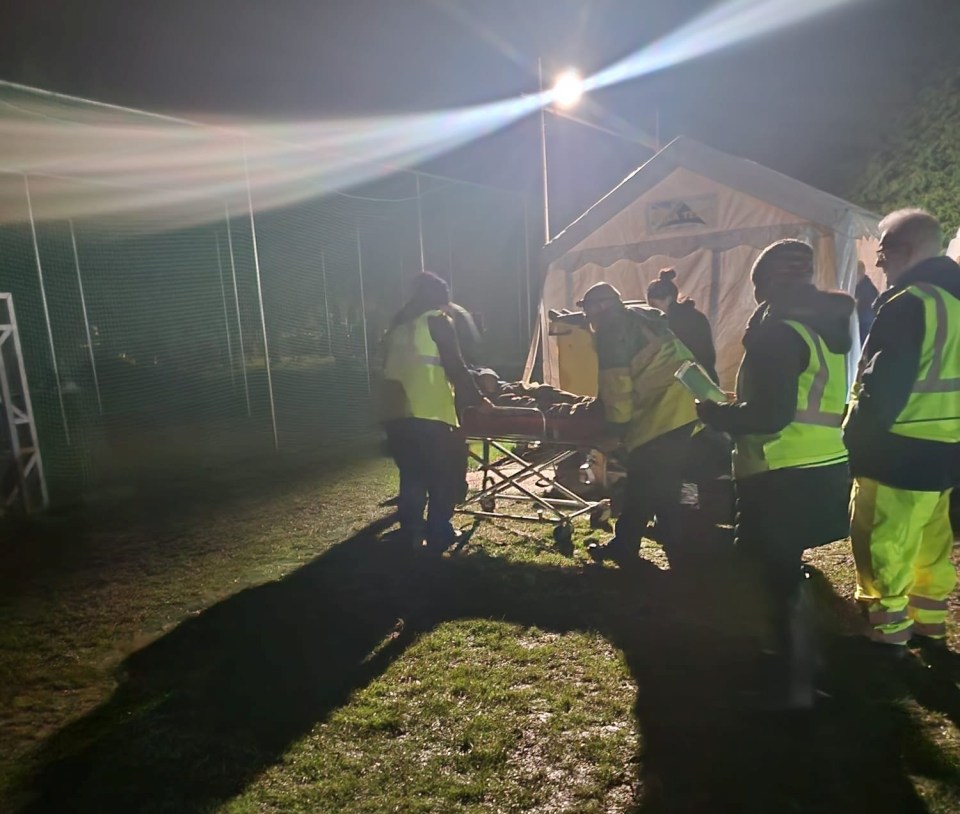 An injured person on a stretcher after the firework display at Stone Swynnerton Park Cricket Club